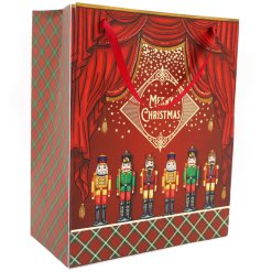 Introducing a traditional and richly decorated nutcracker gift bag with Merry Christmas slogan and luxe handle.
