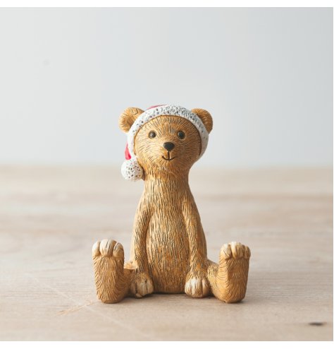A cute sitting bear decoration with Santa's hat. An adorable gift item and interior decoration for this season.