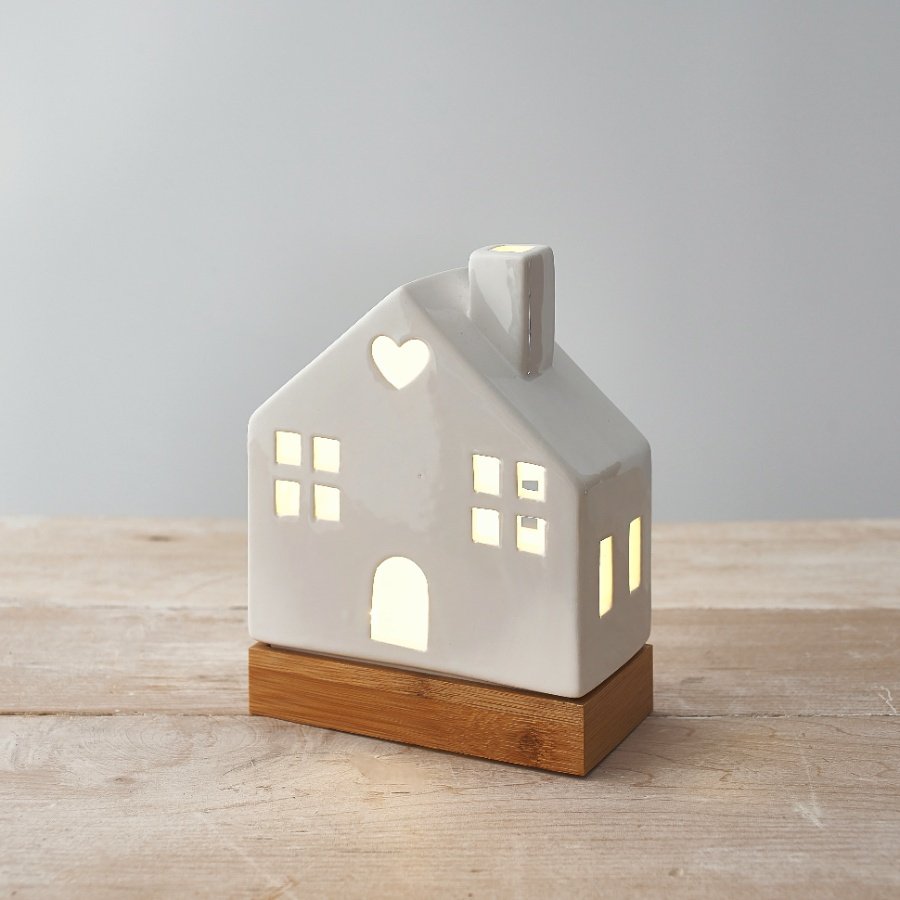 A charming ceramic house decoration in white