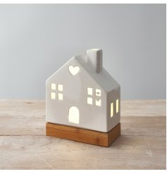A charming ceramic house decoration in white