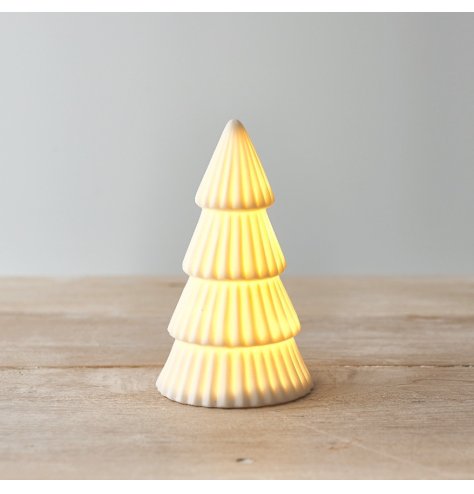 A charming ceramic white tree ornament