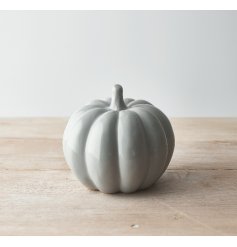 A charming ceramic pumpkin