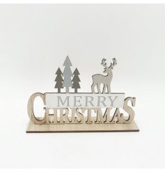 A wooden Merry Christmas sign with woodland design. A chic and contemporary interior accessory this season.
