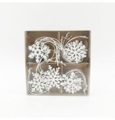 A box of chic wooden snowflakes in an assortment of designs.
