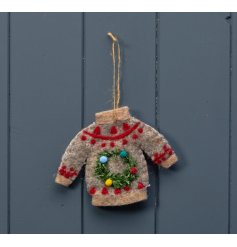 A cute Christmas jumper hanging decoration. Wonderfully detailed with red stitching and complete with a mini wreath