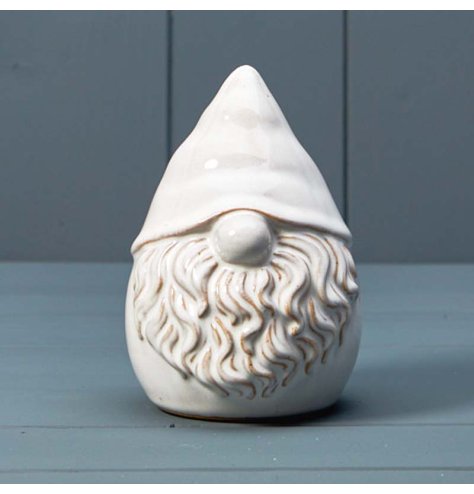 A stylish ceramic gonk ornament with a glaze. A chic seasonal decoration for the home