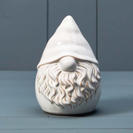 A stylish ceramic gonk ornament with a glaze. A chic seasonal decoration for the home