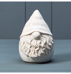 A chic ceramic gonk decoration with a reactive glaze finish. A rustic interior decoration for the home this season. 