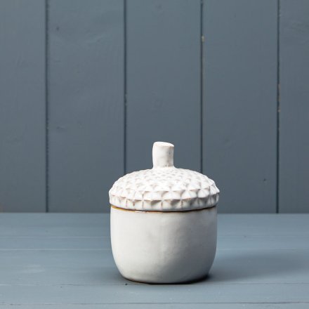 An attractive storage pot in the shape on an acorn. Beautifully detailed with a white reactive glaze.
