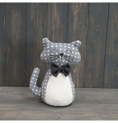 A chic grey and white polka dot doorstop. Complete with bow tie. 