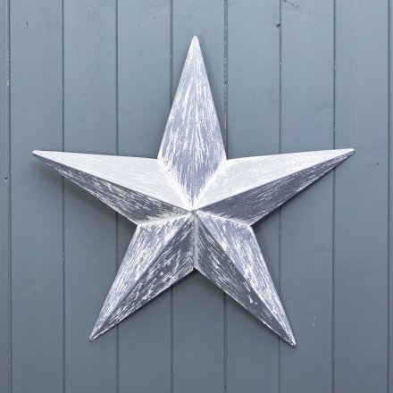 Create a statement with this rustic metal barn star in grey