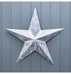 Create a statement with this rustic metal barn star in grey