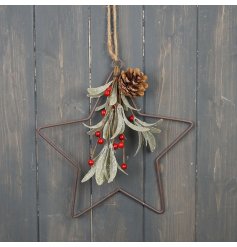 A traditional star shaped metal wreath with artificial berries, mistletoe and a festive pinecone. 