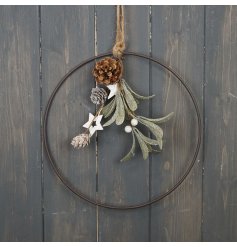 A rustic metal wreath with chunky rope hanger. Complete with a bunch of artificial foliage, pinecones and rustic stars.