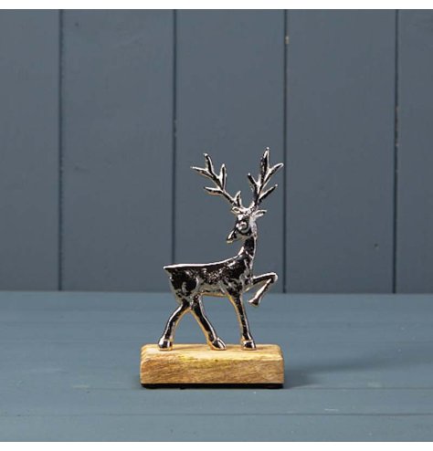 Festive inspired Deer ornament on a wooden base 