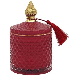 A winter berries candle in a red diamond ridged jar