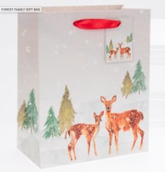 A gift bag featuring an illustration of a family of deers. 