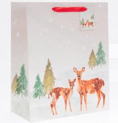 Gift bag featuring a wintery forest scene. 