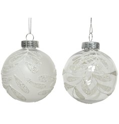 An assortment of 2 matte and transparent shatterproof baubles with a silver glitter leaf design. 