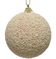 A beaded bauble in a classic natural colour. Complete with gold hanger and gold glitter.