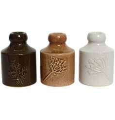 A charming assortment of 3 ceramic candle holders