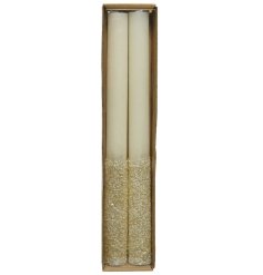 A set of 2 stylish dinner candles with gold glitter. A stylish home accessory and gift item.