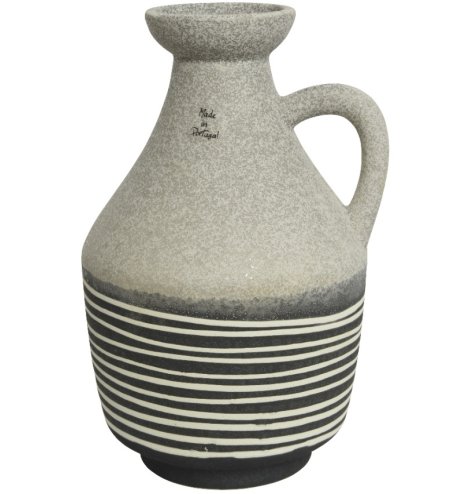 A beautifully crafted earthenware jug. A textured item with a hand painted stripe design.