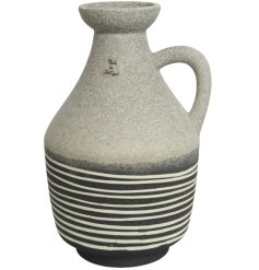 A rustic earthenware vase with a stylish stripe design. 