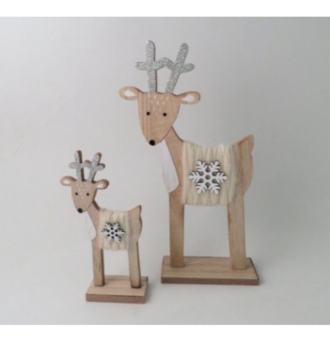 A festive tall wooden decoration of a reindeer