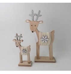 A tall wooden reindeer decoration