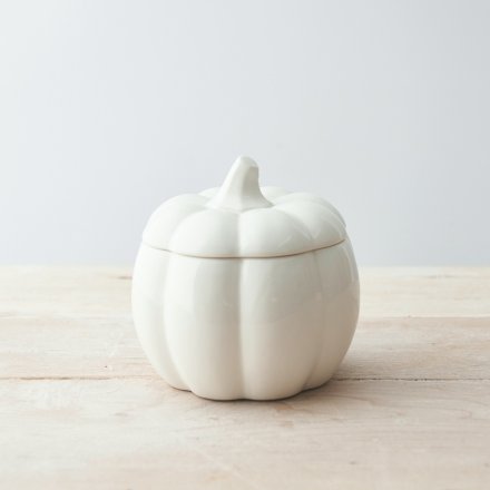 A ceramic storage pot in a pumpkin shape