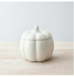 A ceramic storage pot in a pumpkin shape