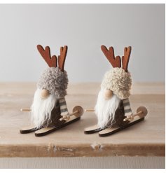 A charming woodland gonk with cute antlers on wooden skis. A unique gift item and interior decoration this season. 