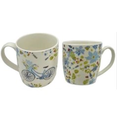 A charming set of 2 Julie Dodsworth porcelain mugs 