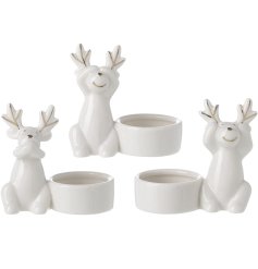 A festive assortment of 3 white porcelain t-light holders