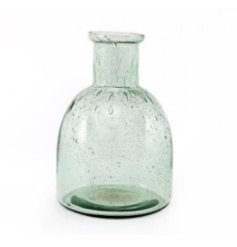 A simplistic clear green vase with handles