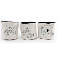 A charming assortment of 3 white canvas storage baskets