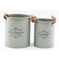 A charming set of 2 metal planters