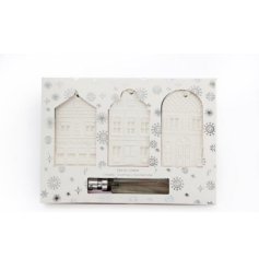 A charming set of 3 embossed house hanging decorations
