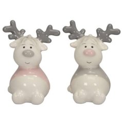 A lovely little assortment of 2 sitting ceramic reindeers