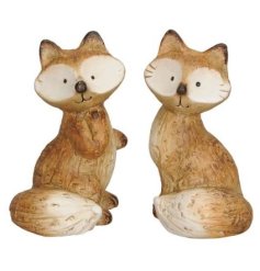 A charming assortment of 2 wooden fox ornaments