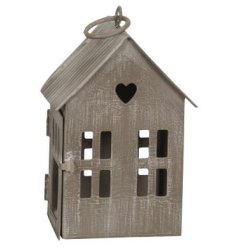 A distressed looking small wooden house decoration