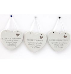A charming assortment of 3 white hanging plaques