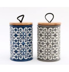 A striking assortment of 2 tall embossed storage pots
