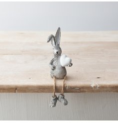 A charming sitting rabbit figure in grey