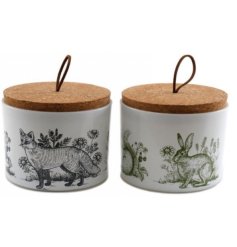 An assortment of 2 beautifully decorated trinket pots with cork lids.