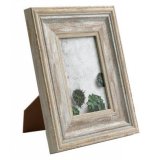 A white washed chunky wooden photo frame. A super stylish and timeless frame to showcase your favourite images.