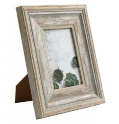 A white washed chunky wooden photo frame. A super stylish and timeless frame to showcase your favourite images.