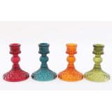 An assortment of 4 jewel coloured glass candle holders perfect for candlesticks. 