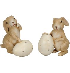 An assortment of 2 adorable bunny ornaments, each with a polka dot egg. 